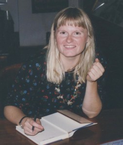 Autographing copies of my first novel, Keeping the Good Light.